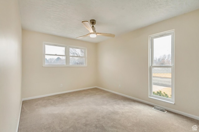 3780 W 5850 S, Roy, UT 84067 - spare room with a textured ceiling, ceiling fan, and light colored carpet