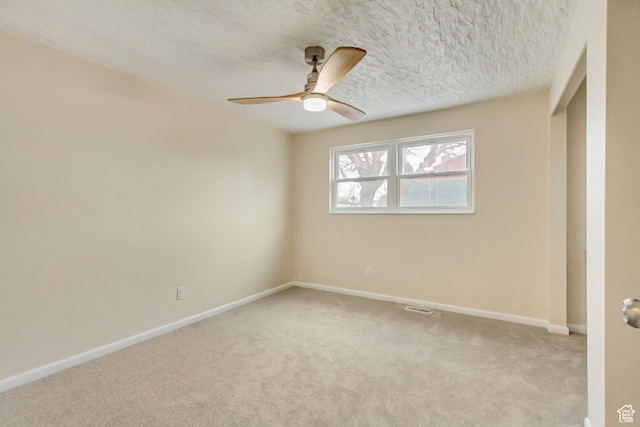 3780 W 5850 S, Roy, UT 84067 - unfurnished bedroom with ceiling fan, light carpet, and a textured ceiling
