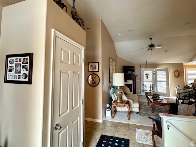 4547 S 1250 W, Riverdale, UT 84405 - entrance foyer featuring a fireplace, light tile patterned floors, lofted ceiling, a ceiling fan, and baseboards
