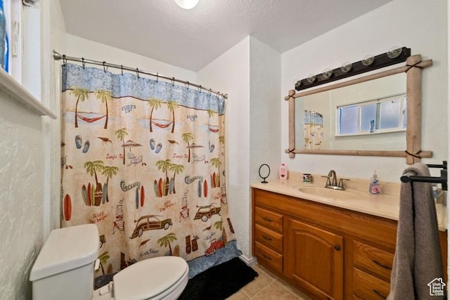 992 N 2050 E, St George, UT 84770 - bathroom featuring vanity, walk in shower, a textured ceiling, tile patterned flooring, and toilet