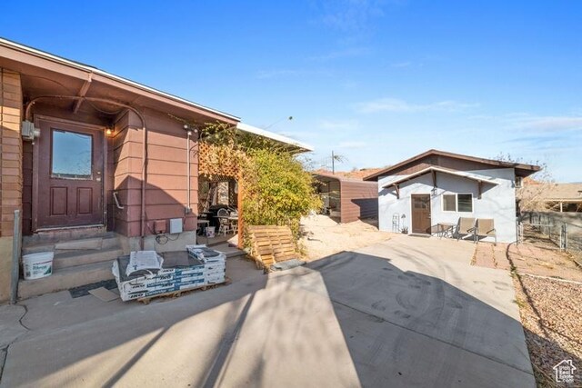 992 N 2050 E, St George, UT 84770 - view of front facade with a shed and a patio area