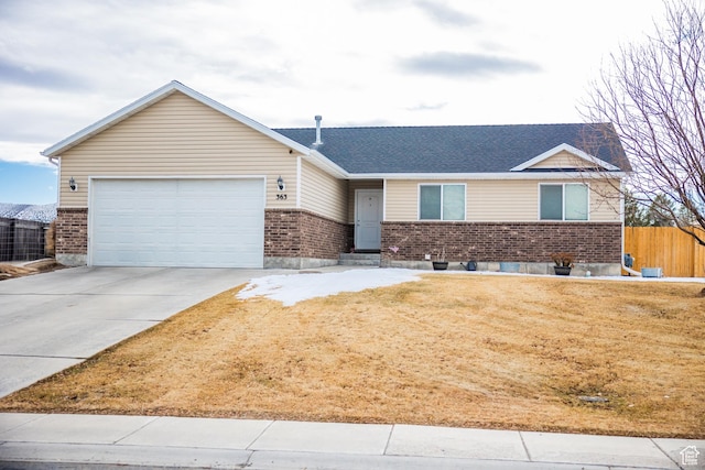 single story home featuring a front yard and a garage