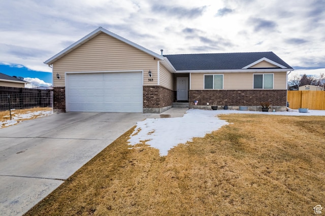 ranch-style home featuring a front yard and a garage