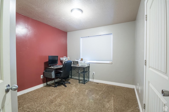 office space with carpet and a textured ceiling