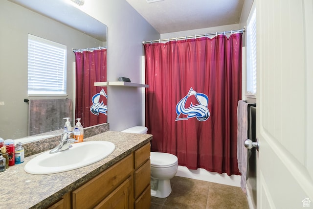 bathroom with vanity, tile patterned flooring, and toilet