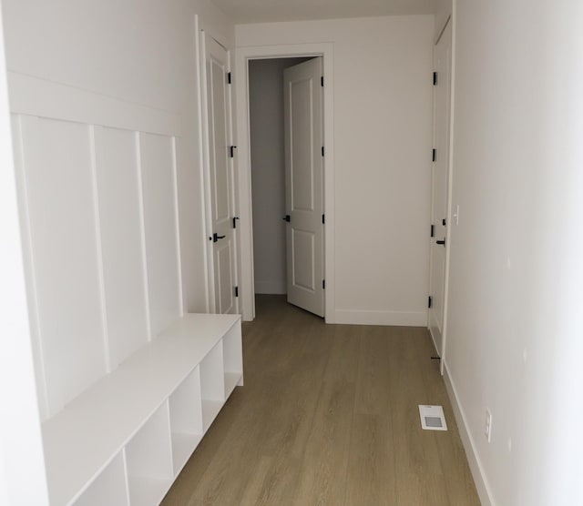 2895 E Liam Ln Unit 106, Eagle Mountain, UT 84005 - mudroom featuring light wood-style floors and baseboards