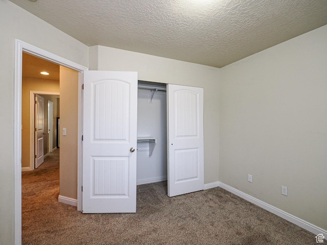 7058 S Greensand Dr, West Jordan, UT 84084 - unfurnished bedroom with carpet flooring, a closet, and a textured ceiling