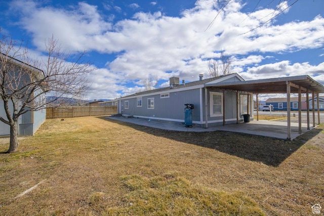 115 E 470 N, Centerfield, UT 84622 - exterior space with a patio area, a fenced backyard, a lawn, and an attached carport