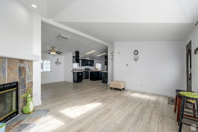 115 E 470 N, Centerfield, UT 84622 - living room with light wood-style flooring, lofted ceiling with beams, a fireplace, and baseboards