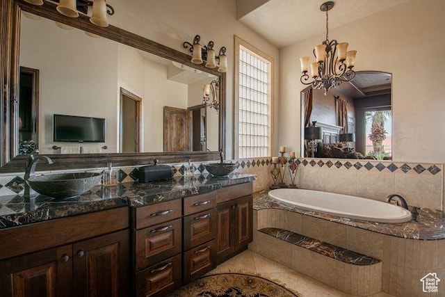 2024 W 450th Cir S, St George, UT 84770 - full bath with double vanity, a sink, tile patterned floors, a notable chandelier, and a garden tub