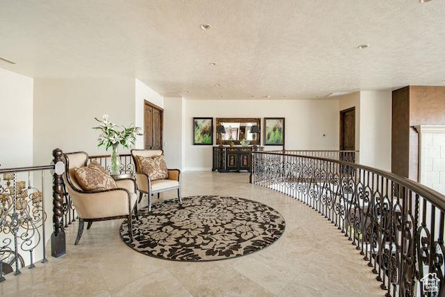2024 W 450th Cir S, St George, UT 84770 - interior space featuring a textured ceiling and an upstairs landing