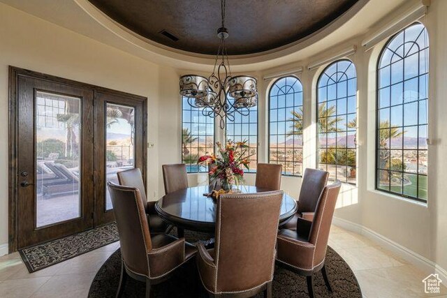 2024 W 450th Cir S, St George, UT 84770 - dining room featuring light tile patterned floors, visible vents, a raised ceiling, baseboards, and a notable chandelier