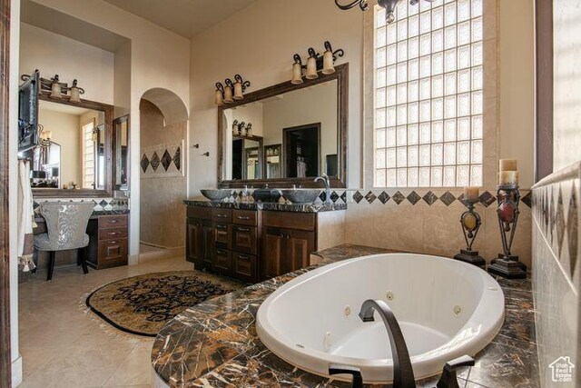 2024 W 450th Cir S, St George, UT 84770 - full bath with vanity, tile walls, and a tub with jets