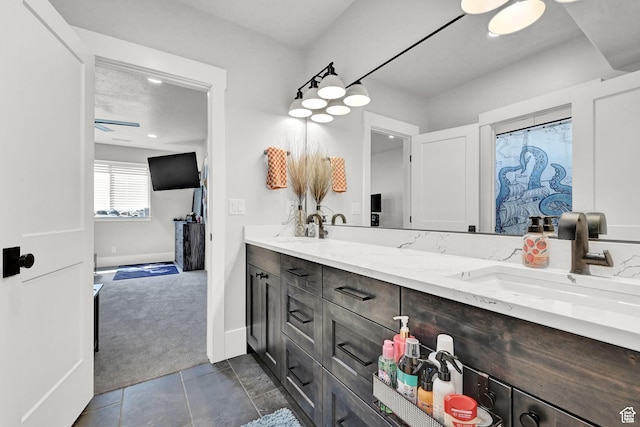 2673 S 4950 W, Taylor, UT 84401 - full bath with double vanity, baseboards, and a sink