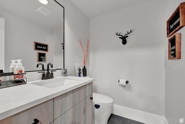 2673 S 4950 W, Taylor, UT 84401 - bathroom featuring visible vents, vanity, toilet, and baseboards