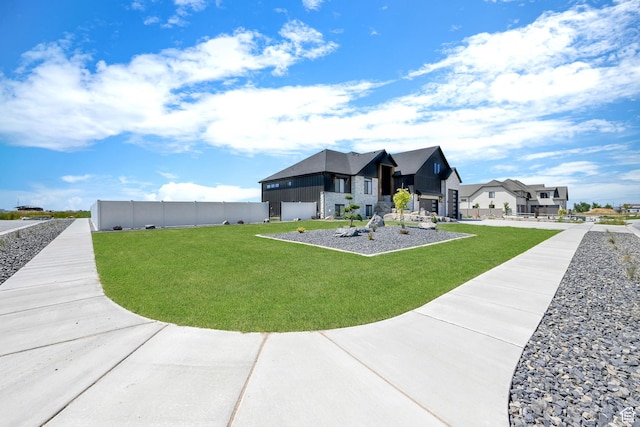 2673 S 4950 W, Taylor, UT 84401 - exterior space with a front yard, a residential view, and fence