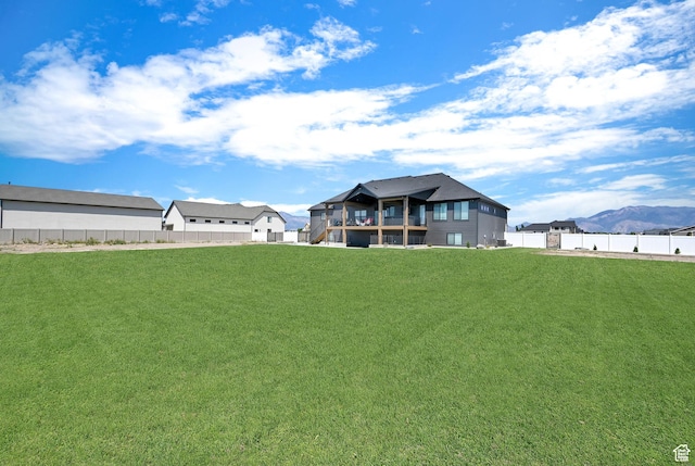 2673 S 4950 W, Taylor, UT 84401 - rear view of property with fence, a mountain view, and a yard
