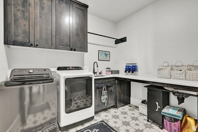 2673 S 4950 W, Taylor, UT 84401 - washroom featuring light floors, cabinet space, a sink, and washing machine and clothes dryer