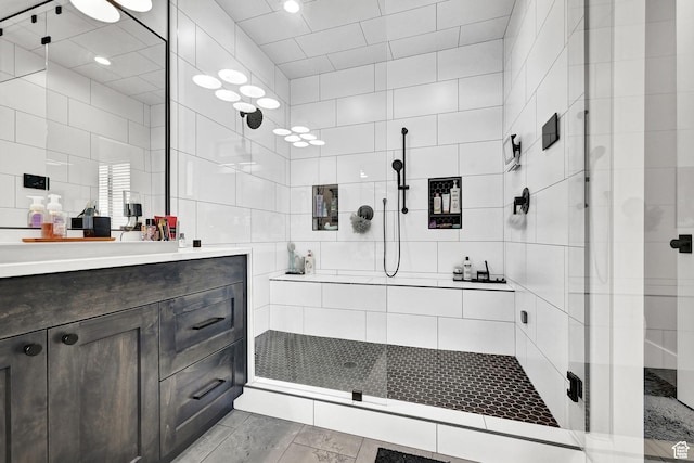 2673 S 4950 W, Taylor, UT 84401 - full bathroom featuring a stall shower, tile walls, and vanity