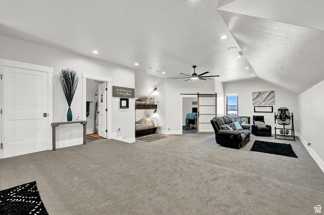 2673 S 4950 W, Taylor, UT 84401 - living room featuring a barn door, a ceiling fan, lofted ceiling, carpet, and a textured ceiling