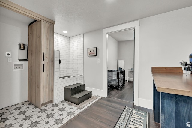 2673 S 4950 W, Taylor, UT 84401 - interior space featuring baseboards, a textured ceiling, and wood finished floors