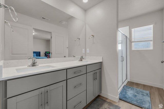1982 N Red Yearling Dr, Saratoga Springs, UT 84045 - bathroom featuring visible vents, a sink, and a shower stall