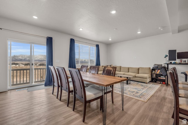 1982 N Red Yearling Dr, Saratoga Springs, UT 84045 - dining area with recessed lighting, light wood-style floors, a healthy amount of sunlight, and a textured ceiling
