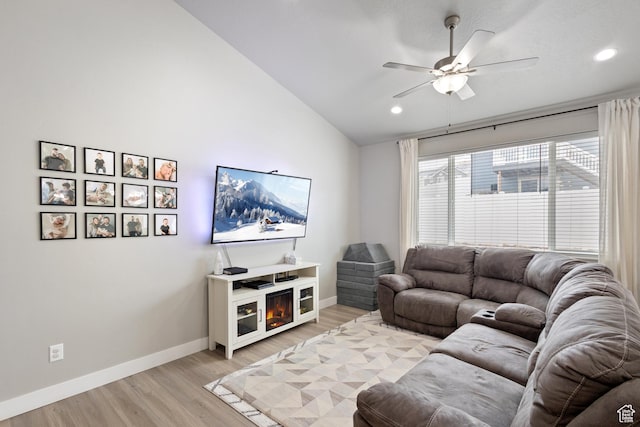 4142 N Fairfield Dr, Eagle Mountain, UT 84005 - living area with baseboards, vaulted ceiling, light wood finished floors, and ceiling fan