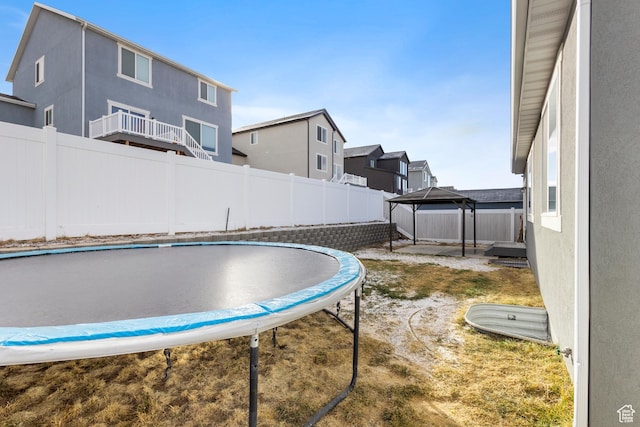 4142 N Fairfield Dr, Eagle Mountain, UT 84005 - view of pool with a gazebo, a trampoline, and a fenced backyard