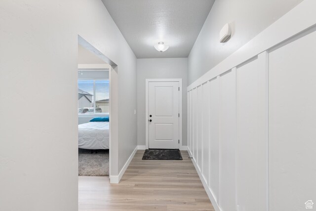 4142 N Fairfield Dr, Eagle Mountain, UT 84005 - doorway with baseboards and light wood-style floors