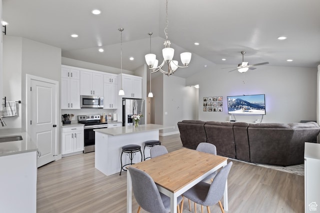 4142 N Fairfield Dr, Eagle Mountain, UT 84005 - dining space featuring light wood-type flooring, ceiling fan, lofted ceiling, and recessed lighting