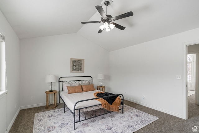 bedroom with baseboards, lofted ceiling, ceiling fan, and carpet floors
