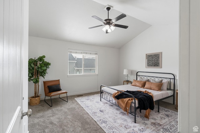 carpeted bedroom with a ceiling fan, baseboards, and lofted ceiling