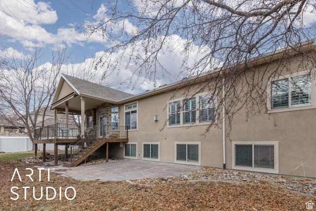 3013 W Alta Peak Rd, South Jordan, UT 84095 - back of house featuring stucco siding, visible vents, a patio area, fence, and stairs