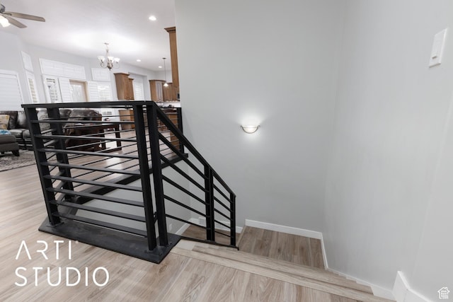 3013 W Alta Peak Rd, South Jordan, UT 84095 - staircase with baseboards, wood finished floors, and recessed lighting