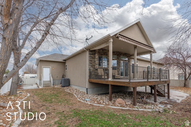 3013 W Alta Peak Rd, South Jordan, UT 84095 - back of house with entry steps, central AC, fence, a wooden deck, and stucco siding