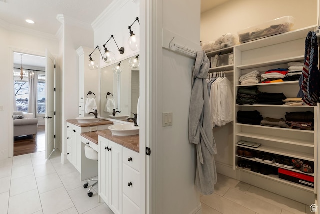 1609 E Quail Way, Logan, UT 84321 - full bath with a spacious closet, tile patterned floors, vanity, and ornamental molding