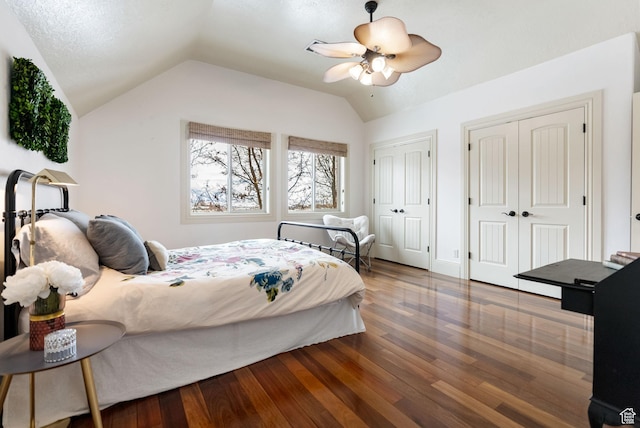 1609 E Quail Way, Logan, UT 84321 - bedroom with two closets, vaulted ceiling, a ceiling fan, and wood finished floors