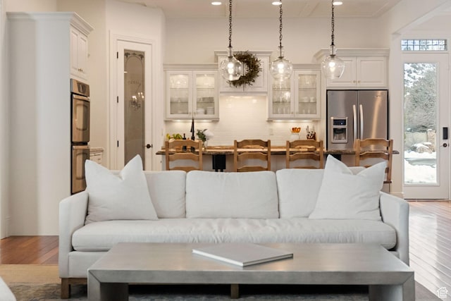 1609 E Quail Way, Logan, UT 84321 - living area with recessed lighting and wood finished floors