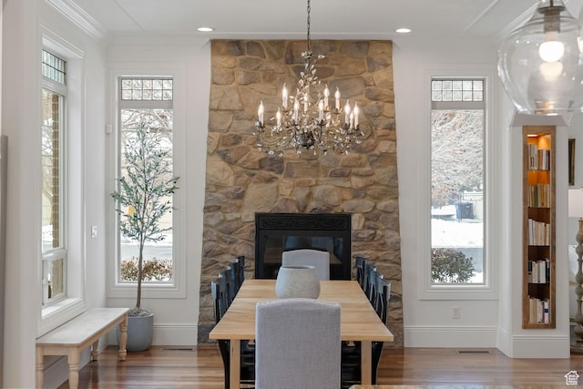 1609 E Quail Way, Logan, UT 84321 - dining area featuring wood finished floors, baseboards, a notable chandelier, and a wealth of natural light