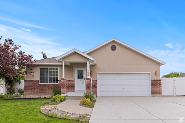 298 Beaumont Dr, Kaysville, UT 84037 - single story home featuring brick siding, concrete driveway, an attached garage, and stucco siding