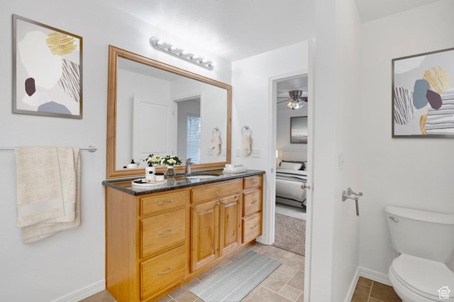 298 Beaumont Dr, Kaysville, UT 84037 - ensuite bathroom with ceiling fan, vanity, toilet, and baseboards