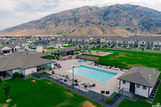 exterior space with a residential view and a mountain view