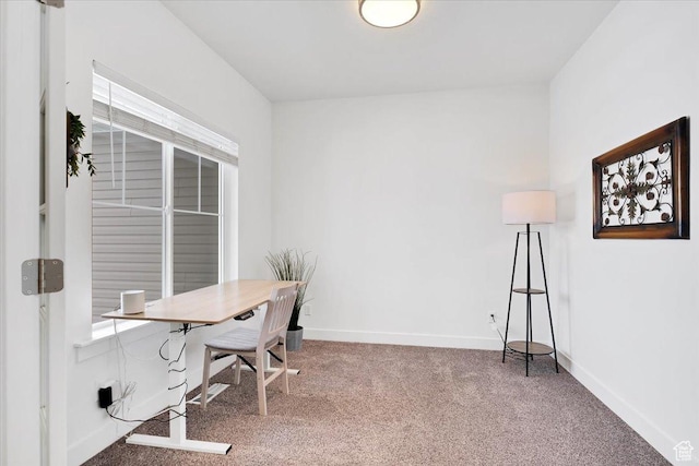 carpeted home office with baseboards