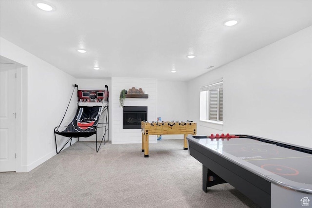 recreation room featuring recessed lighting, baseboards, carpet, and a fireplace