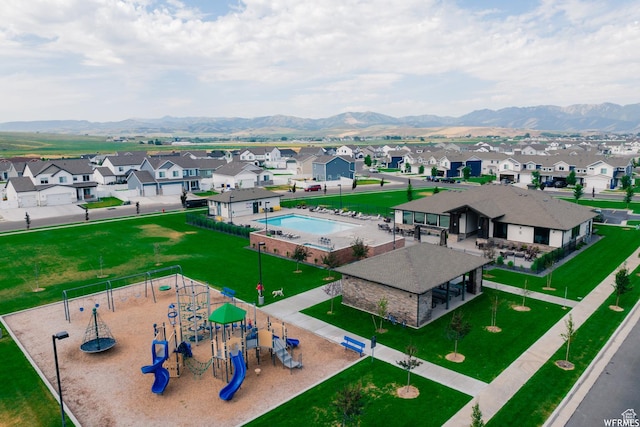 birds eye view of property featuring a mountain view and a residential view