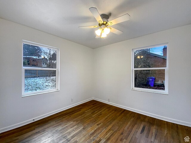 2943 S 400 W, Bountiful, UT 84010 - spare room featuring dark wood-type flooring, baseboards, and a ceiling fan