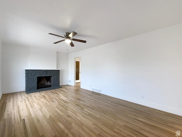 2943 S 400 W, Bountiful, UT 84010 - unfurnished living room featuring ceiling fan, visible vents, baseboards, light wood-style floors, and a brick fireplace