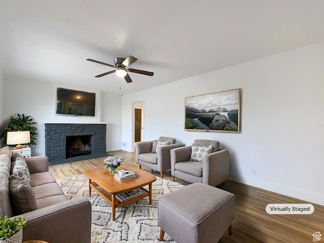 2943 S 400 W, Bountiful, UT 84010 - living area with a ceiling fan, a fireplace, baseboards, and wood finished floors
