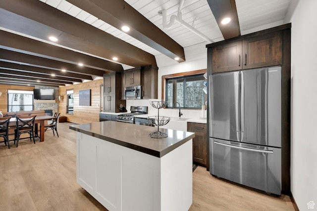 11249 E Columbine Ln Unit 1607, Heber City, UT 84032 - kitchen featuring appliances with stainless steel finishes, wood walls, beamed ceiling, dark brown cabinets, and light wood-style flooring